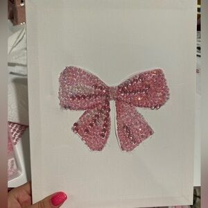 Rhinestone bow on a canvas 8x10